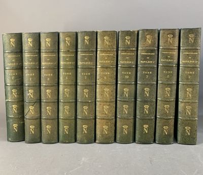 un ensemble de sept livres anciens ornés de lettres dorées
