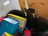 a pile of assorted items in a bin on the floor