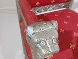 a red and silver chair with a lion head on it
