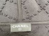 a close up of a chanel label on a dress