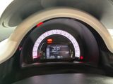 a car dashboard with a speedometer and a clock on it