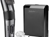 an image of a black and silver hair clipper next to a black box