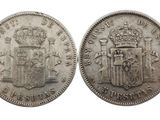 une pièce d'argent sur laquelle figurent des armoiries et une couronne