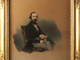 portrait d'un homme barbu assis sur une chaise