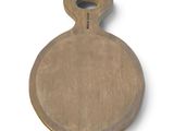 a wooden cutting board with a handle on a white surface