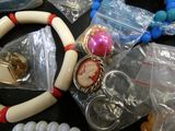 a close up of a bunch of jewelry on a table