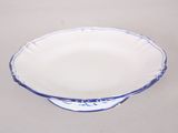 a blue and white bowl sitting on a table