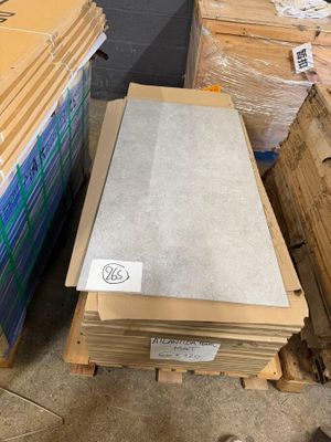 several boxes of cardboard are stacked on top of each other in a warehouse