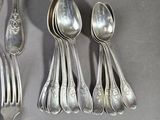 five spoons and two spoons on a table