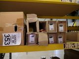 many boxes on a shelf in a store with labels on them