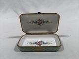 a small box with a floral design on it