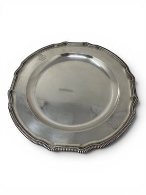 silver plate with beaded edge on a white background