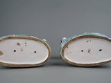 pair of blue and white porcelain figurines of a man and a woman