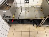 a view of a dirty kitchen with a sink and a stove