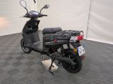 a scooter that is parked in a room
