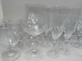 a lot of empty wine glasses sitting on a table