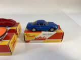 two toy cars that are sitting on top of each other