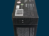 a black box with a label on it sitting on a blue surface