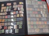 a book with stamps on it sitting on a table