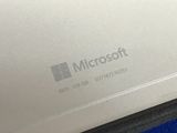 a close up of a laptop with a microsoft logo on it