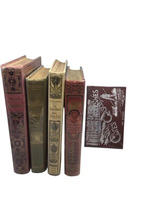 five books that are sitting next to each other on a table