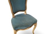 an image of a chair with a blue upholstered seat on a white background