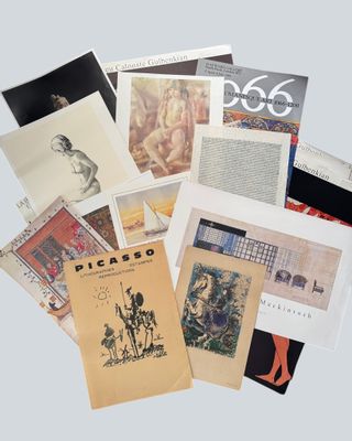 an image of a pile of books with pictures of people on them