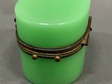 an image of a green container with a rope around it