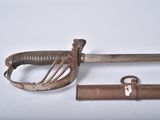 two old swords that are laying next to each other