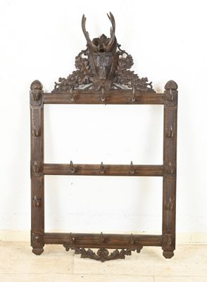 a wooden shelf with a deer head on it