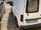 a white van parked in a parking lot next to other cars