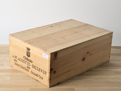 a wooden box that is sitting on a wooden floor