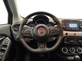 the interior of a car with a steering wheel and dashboard controls