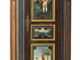 a cabinet with three paintings on the front of it