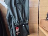 a coat hanging on a clothes rack in a room