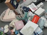 a pile of baby items on the floor in a room