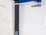a clamp that is attached to a white wall