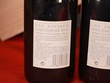 two bottles of wine that are on a table