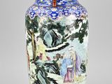 a blue and white vase with a painting on it