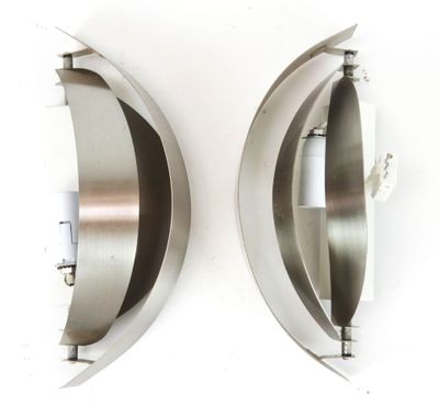 pair of stainless steel wall sconces on a white wall
