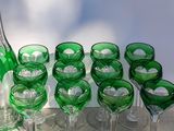 bottles and glasses are lined up on a tray on a table