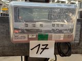 a parking meter that has a number on the front of it