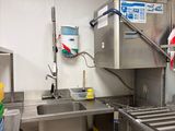 a kitchen with stainless steel appliances and a sink