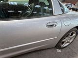 a silver car parked on the side of the street