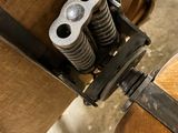 a piece of wood that has a couple of springs attached to it