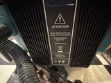 an image of a close up of a machine with a hose attached to it