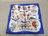 an image of a blue and white scarf with a picture of hot air balloons on it