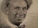a black and white photo of a man with a hat and bow tie