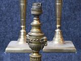 three candles that are sitting on a table
