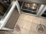 a small oven that is sitting in the middle of the floor